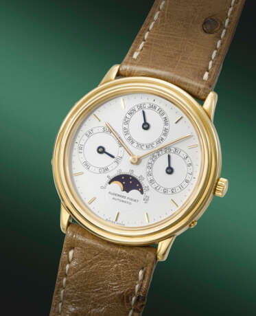 AUDEMARS PIGUET. AN ELEGANT 18K GOLD AUTOMATIC PERPETUAL CALENDAR WRISTWATCH WITH MOON PHASES - фото 2