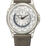 PATEK PHILIPPE. AN EXTREMELY RARE AND COVETED 18K WHITE GOLD AUTOMATIC WORLD TIME WRISTWATCH - photo 1