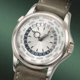PATEK PHILIPPE. AN EXTREMELY RARE AND COVETED 18K WHITE GOLD AUTOMATIC WORLD TIME WRISTWATCH - photo 2