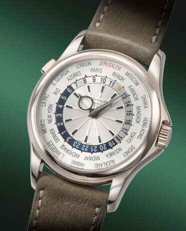 PATEK PHILIPPE. AN EXTREMELY RARE AND COVETED 18K WHITE GOLD AUTOMATIC WORLD TIME WRISTWATCH - фото 2