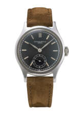 PATEK PHILIPPE. AN EXCEEDINGLY RARE AND HIGHLY ATTRACTIVE STAINLESS STEEL WRISTWATCH WITH BLACK DIAL