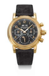 PATEK PHILIPPE. A VERY RARE AND HIGHLY ATTRACTIVE 18K PINK GOLD PERPETUAL CALENDAR SPLIT SECONDS CHRONOGRAPH WRISTWATCH WITH MOON PHASES, 24 HOUR AND LEAP YEAR INDICATION