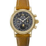 PATEK PHILIPPE. AN IMPORTANT AND POSSIBLY UNIQUE 18K GOLD SPLIT SECONDS CHRONOGRAPH PERPETUAL CALENDAR WRISTWATCH WITH MOON PHASES, 24 HOUR, LEAP YEAR INDICATION AND BLACK MONOGRAM DIAL WITH LUMINOUS HOUR MARKERS AND TACHYMETER SCALE - photo 1