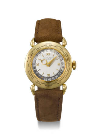 PATEK PHILIPPE. A VERY RARE AND ATTRACTIVE 18K GOLD WORLD TIME WRISTWATCH - Foto 1