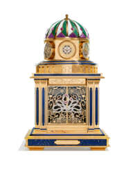 CROWN. A UNIQUE, EXTRAORDINARY AND MAGNIFICENT SILVER-GILT, LAPIS LAZULI, AVENTURINE, RUBELITE, DIAMOND AND RUBY-SET ELECTRO-MECHANICAL MUSICAL AUTOMATON WORLD TIME TABLE CLOCK WITH PERPETUAL CALENDAR, ASTROLABE, THERMOMETER, HYGROMETER AND REMOTE CONTROL