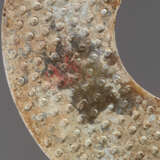 A STRONGLY CALCIFIED BI DISC WITH SCROLLS IN RELIEF - photo 4