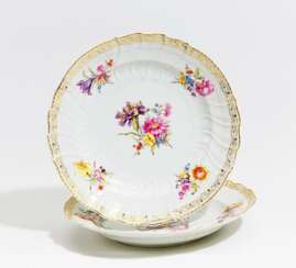 Two deep plates with floral decoration and the monogram of Wilhelm II