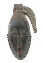 Maske der Guro Elfenbeinküste, spitzovale und schw…