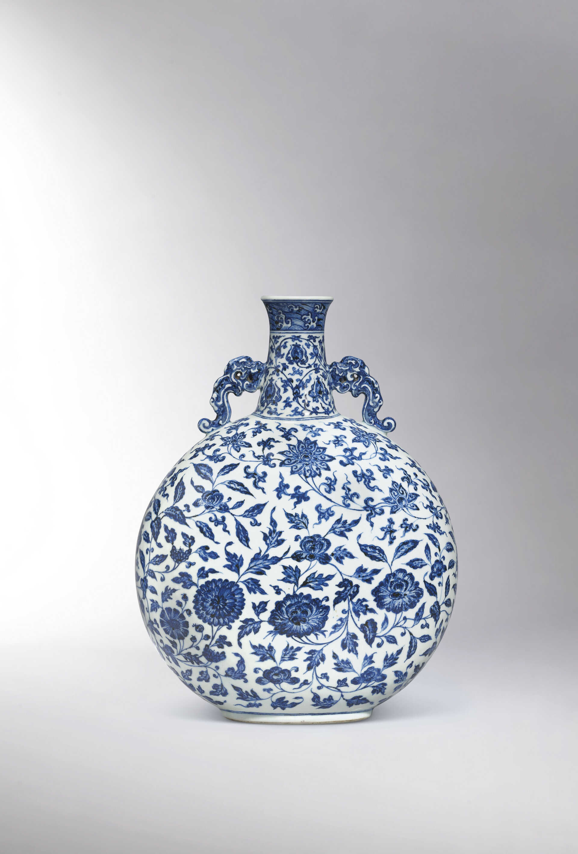 A FINE MAGNIFICENT AND EXCEEDINGLY RARE BLUE AND WHITE ‘FLOWERS OF THE FOUR SEASONS’ MOONFLASK