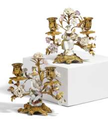 PAIR OF GILT BRONZE CANDELABRAS WITH TENDRIL BRANCHES AND PORCELAIN MUSICIANS