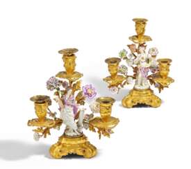 PAIR OF EXCEPTIONAL GILT BRONZE CANDELABRAS WITH BLOSSOMS AND DECORATIVE PORCELAIN FIGURES