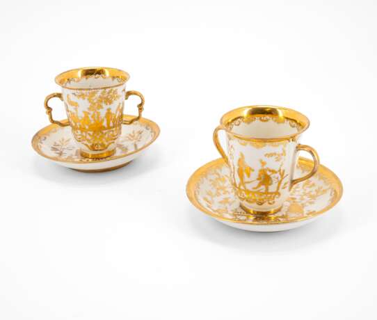 TWO PORCELAIN BEAKERS WITH DOUBLE HANDLE AND SAUCERS WITH GOLDEN CHINOISERIES - photo 1