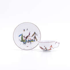PORCELAIN CUP AND SAUCER WITH MYTHICAL CREATURES