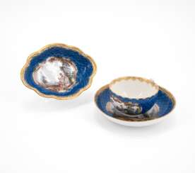 PORCELAIN CUP AND SAUCER AND MATCHING BOWL WITH BLUE SCALES DECOR AND CARTOUCHES WITH GARDEN SCENES