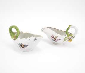 TWO PORCELAIN LEAF SAUCIERES WITH WOODCUT FLOWERS AND HANDLES IN THE SHAPE OF BRANCHES