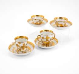TWO PORCELAIN TEA BOWLS AND SAUCERS & TWO PORCELAIN BEAKERS AND SAUCERS WITH DECORATED-OVER GOLDEN CHINOISERIES