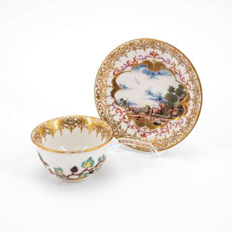 PORCELAIN TEA BOWL AND SAUCER WITH LANDSCAPE CARTOUCHES AND APPLIED VINE LEAVES DECOR - photo 1