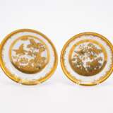 ONE PORCELAIN TEA BOWL AND TWO SAUCERS WITH DECORATED-OVER BIRD & ROCK DECORS - фото 2
