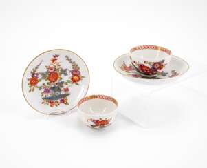 TWO PORCELAIN TEA BOWLS WITH SAUCERS AND DECORATED-OVER TABLE PATTERN