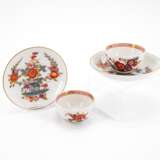 TWO PORCELAIN TEA BOWLS WITH SAUCERS AND DECORATED-OVER TABLE PATTERN - photo 1