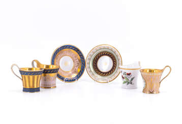 FOUR PORCELAIN CAMPANER CUPS WITH DIFFERENT DECORS OF WHICH TWO ARE WITH SAUCERS