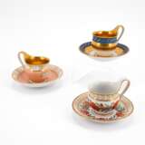 THREE PORCELAIN CUPS AND MATCHING SAUCERS WITH DIFFERENT ORNAMENTATION AND GROUND DECORS - фото 1