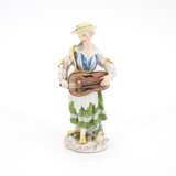 PORCELAIN FEMALE MUSICIAN WITH HURDY-GURDY - photo 1