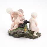 THREE PORCELAIN CUPIDS WITH MOORHEN - photo 1