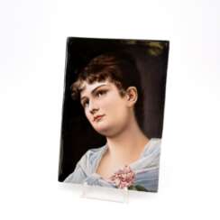 PORCELAIN PLAQUE OF A YOUNG GIRL