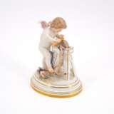 PORCELAIN CUPID HONING A GOLDEN ARROW ON A GRINDSTONE - photo 1