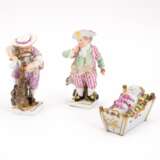 PORCELAIN CHILD FIGURINE WITH DOG, PORCELAIN CHILD FIGURINE OF A WOODCUTTER AND A PORCELAIN CRADLE WITH INFANT - photo 1