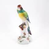 LARGE PORCELAIN PARROT SITTING ON TREE TRUNK WITH CHERRY - photo 1