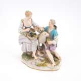 PORCELAIN ENSEMBLE OF A SHEPHERD AND SHEPHERDESS WITH GRAPE BASKET ON MOUND BASE WITH LAMB RUNNING IN THE MIDDLE - фото 1
