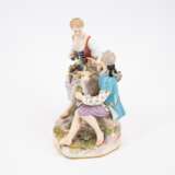 PORCELAIN ENSEMBLE OF A SHEPHERD AND SHEPHERDESS WITH GRAPE BASKET ON MOUND BASE WITH LAMB RUNNING IN THE MIDDLE - photo 2