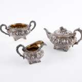 THREE PIECE SILVER GEORGE IV TEA SERVICE WITH FLORAL RELIEF DECOR - фото 1