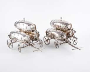 TWO SMALL CARTS WITH EACH THREE LIQUOR BARRELS
