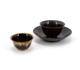 CERAMIC TEA BOWL AND SAUCER WITH CHINOISERIES AND A PORCELAIN TEA BOWL WITH MIRROR MONOGRAM