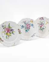 THREE FAIENCE PLATES WITH