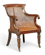 Bergere chair. A WILLIAM IV MAHOGANY LIBRARY BERGERE