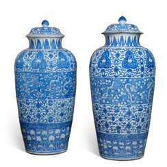 A PAIR OF CHINESE BLUE AND WHITE &#39;SOLDIER&#39; VASES AND COVERS