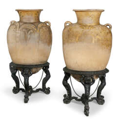 A PAIR OF MEXICAN POLYCHROME-DECORATED AND PARCEL-GILT EARTHENWARE OVOID JARS OR BUCAROS
