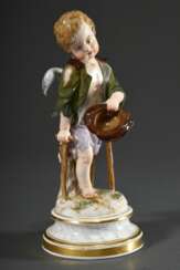 Meissen Figur „Amor als Bettler“ auf profiliertem Rundsockel mit Terrainplinthe, polychrom staffiert, Entw.: Heinrich Schwabe, um 1900, zeitnahe Ausführung, Modellnr.: L112, Bossiernr.: 42, Malernr.: 58, H. 22cm, rest., am Standring bestoßen