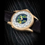 PATEK PHILIPPE. AN 18K PINK GOLD AUTOMATIC WORLD TIME WRISTWATCH WITH
CLOISONN&#201; ENAMEL DIAL - photo 1
