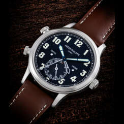 PATEK PHILIPPE. AN 18K WHITE GOLD AUTOMATIC DUAL TIME WRISTWATCH WITH SWEEP CENTRE SECONDS, DAY/NIGHT INDICATION AND DATE