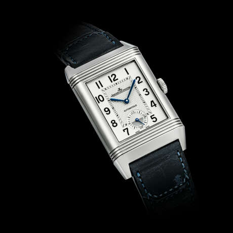 JAEGER-LECOULTRE. AN ATTRACTIVE STAINLESS STEEL REVERSIBLE DUAL FACE AUTOMATIC WRISTWATCH WITH DUAL TIME AND 24 HOUR INDICATION - Foto 1