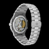 PATEK PHILIPPE. A STAINLESS STEEL AUTOMATIC WRISTWATCH WITH POWER RESERVE, MOON PHASES, DATE AND BRACELET - photo 2