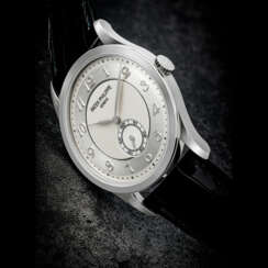 PATEK PHILIPPE. A PLATINUM WRISTWATCH WITH TWO-TONE DIAL AND BREGUET NUMERALS