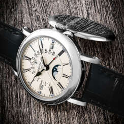 PATEK PHILIPPE. AN 18K WHITE GOLD AUTOMATIC PERPETUAL CALENDAR WRISTWATCH WITH SWEEP CENTRE SECONDS, RETROGRADE DATE, LEAP YEAR INDICATION AND MOON PHASES