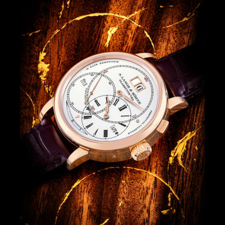 A. LANGE & S&#214;HNE. A RARE AND COMPLICATED 18K PINK GOLD PERPETUAL CALENDAR WRISTWATCH WITH REGULATOR DIAL, OVERSIZED DATE, LEAP YEAR, ORBITAL MOON-PHASES, DAY/NIGHT INDICATIONS FOR NORTHERN HEMISPHERE AND 14 DAYS POWER RESERVE - Foto 1