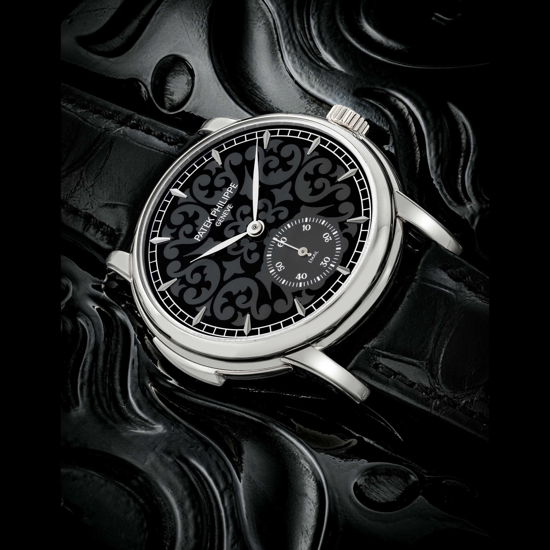 PATEK PHILIPPE. A RARE AND ATTRACTIVE 18K WHITE GOLD AUTOMATIC MINUTE REPEATING WRISTWATCH WITH GRAND FEU BLACK ENAMEL DIAL